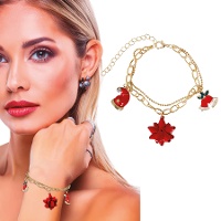 Armband mit goldener Weihnachtsmütze, Glocke und Blume - 1 Stück